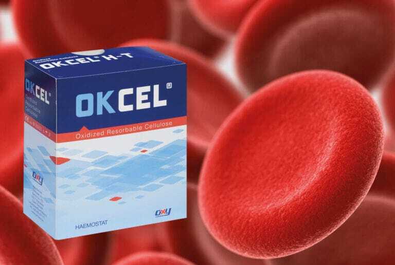 A box of Okcel haemostats prominently displayed against a background of red blood cells, highlighting the advanced solutions Okcel provides in improving patient outcomes.  